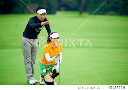 Two people playing golf Two people playing golf 45187219