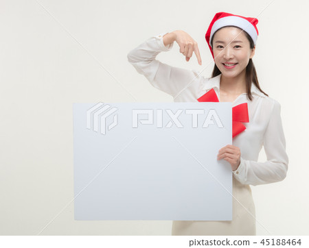 Christmas Day. Korea woman holding a white card Christmas Day. Korea woman holding a white card 45188464