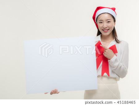 Christmas Day. Korea woman holding a white card Christmas Day. Korea woman holding a white card 45188465