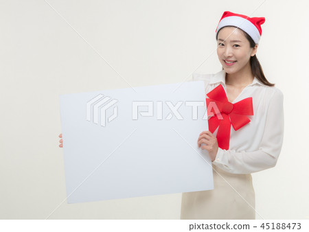 Christmas Day. Korea woman holding a white card Christmas Day. Korea woman holding a white card 45188473