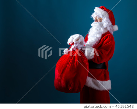 Santa holding a red sack Santa holding a red sack 45191548