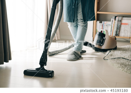Feet of Japanese woman vacuuming 45193180