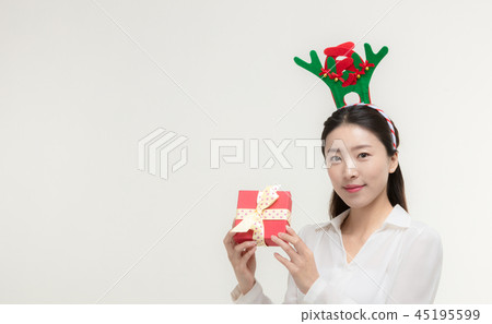 Christmas Day. Korea woman holding xmas props Christmas Day. Korea woman holding xmas props 45195599