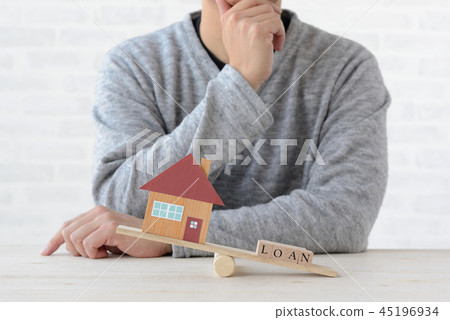 Men thinking about the balance between housing and payment Men thinking about the balance between housing and payment 45196934