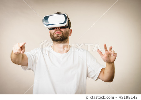 Adult man wearing vr goggles Adult man wearing vr goggles 45198142