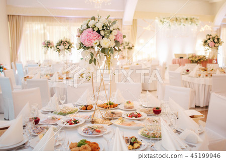 Wedding bouquet in restaurant on the table. Pink and white flowers. Rose and hydrangea Wedding bouquet in restaurant on the table. Pink and white flowers. Rose and hydrangea 45199946