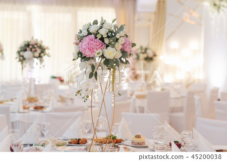 Wedding bouquet in restaurant on the table. Pink and white flowers. Rose and hydrangea 45200038