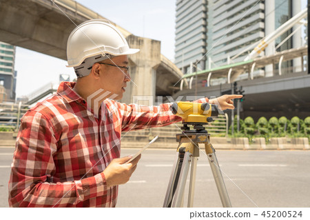 Engineer man survey with tacheometer or theodolite 45200524