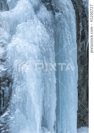 icefall on a rock wall icefall on a rock wall 45200727