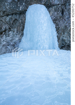 icefall on a rock wall 45200752
