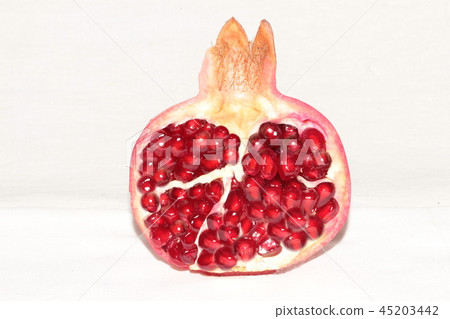 ripe, red pomegranates grown in the garden ripe, red pomegranates grown in the garden 45203442