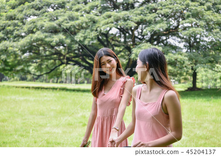 Holiday concept. Beautiful girl is getting flowers. Beautiful gi 45204137
