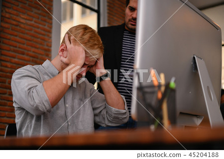 Business concept. Businessmen are under pressure from work. Youn 45204188