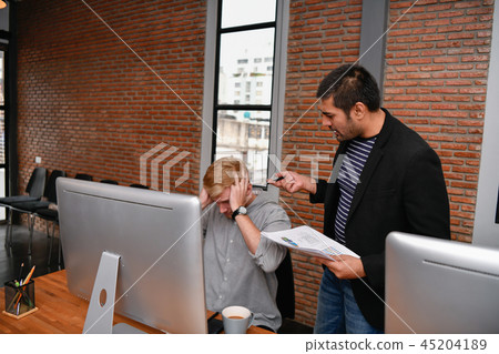 Business concept. Businessmen are under pressure from work. Youn Business concept. Businessmen are under pressure from work. Youn 45204189