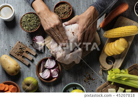 young man preparing a turkey young man preparing a turkey 45207818