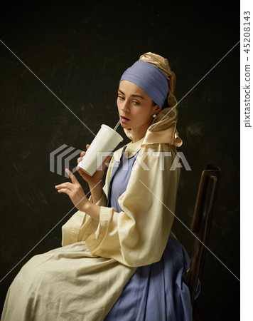 Medieval Woman in Historical Costume Wearing Corset Dress and Bonnet. 45208143