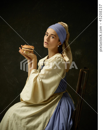 Medieval Woman in Historical Costume Wearing Corset Dress and Bonnet. 45208157