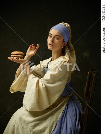 Medieval Woman in Historical Costume Wearing Corset Dress and Bonnet. Medieval Woman in Historical Costume Wearing Corset Dress and Bonnet. 45208158