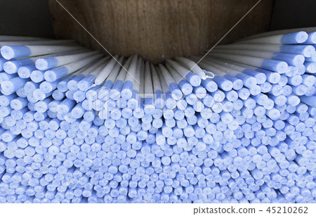 Blue candles piled 45210262