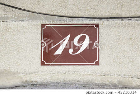 Metal plate with the number nineteen 45210314
