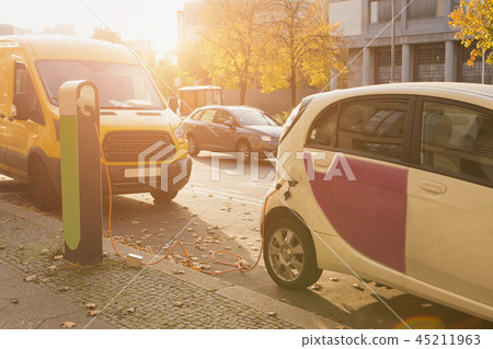 The rental car is charging at the charging station 45211963