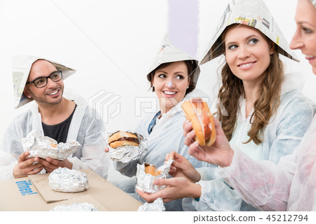 Friends enjoying the fast food at new house Friends enjoying the fast food at new house 45212794