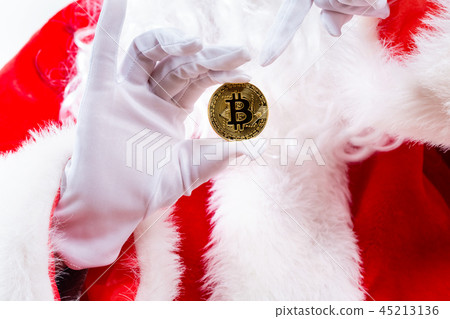 Santa holding a bitcoin Santa holding a bitcoin 45213136