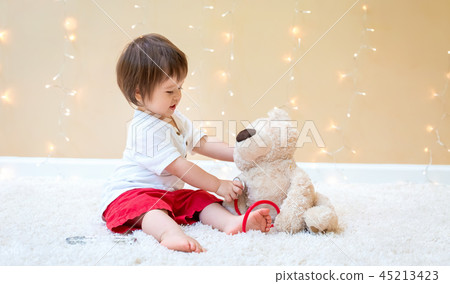 Toddler boy with teddy bear doctor Toddler boy with teddy bear doctor 45213423