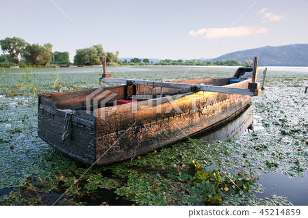 Fishing boat on the lake Orestiada in Kastoria Fishing boat on the lake Orestiada in Kastoria 45214859