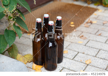Four empty beer bottles  45214976