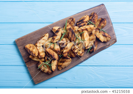 Homemade grilled potatoes with rosemary Homemade grilled potatoes with rosemary 45215038