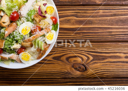 Salad ceasar with chicken , eggs and tomatoes Salad ceasar with chicken , eggs and tomatoes 45216036