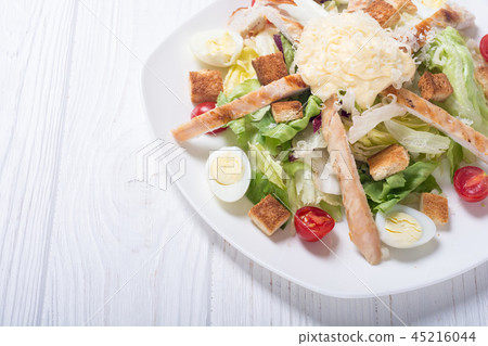 Salad ceasar with chicken , eggs and tomatoes Salad ceasar with chicken , eggs and tomatoes 45216044