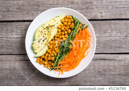 Buddha bowl with avocado cucumber carrot chickpea Buddha bowl with avocado cucumber carrot chickpea 45216780