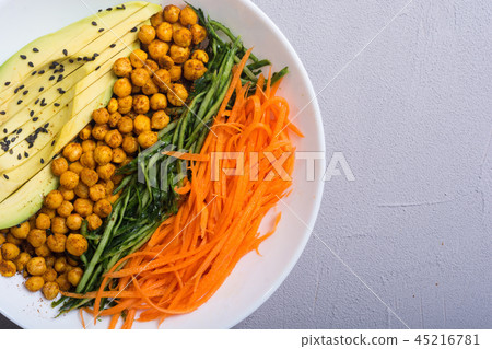 Buddha bowl with avocado cucumber carrot chickpea Buddha bowl with avocado cucumber carrot chickpea 45216781
