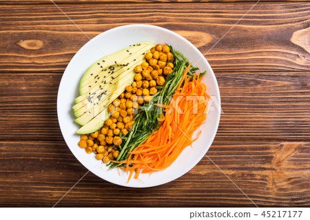 Buddha bowl with avocado cucumber carrot chickpea Buddha bowl with avocado cucumber carrot chickpea 45217177