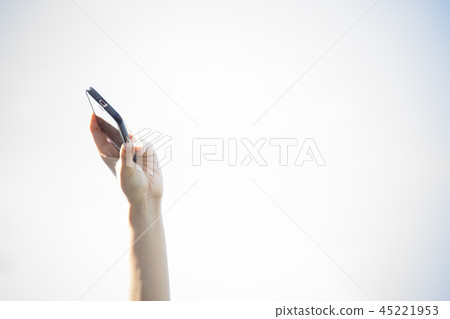 Hand holding a smartphone Hand holding a smartphone 45221953