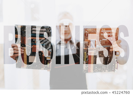 Expert Repairman is Holding Motherboard. 45224760