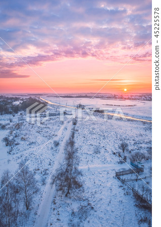 Field with a river at dawn in the winter morning 45225578