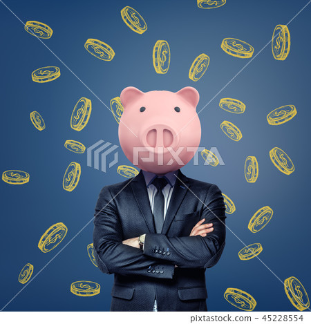 A businessman with folded arms stands wearing a pink pig mask on a background with chalk golden A businessman with folded arms stands wearing a pink pig mask on a background with chalk golden 45228554