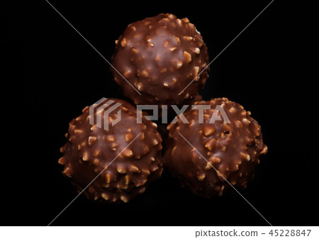 Luxury chocolate candies with hazelnuts Luxury chocolate candies with hazelnuts 45228847