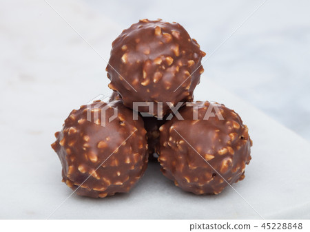 Luxury chocolate candies with hazelnuts Luxury chocolate candies with hazelnuts 45228848