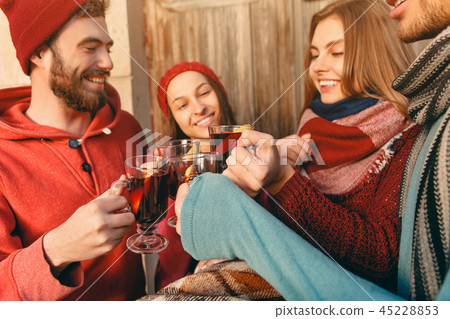 Smiling european men and women during party photoshoot. Smiling european men and women during party photoshoot. 45228853