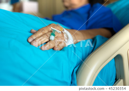 Blood test tube on senior woman patient hand in hospital. 45230354