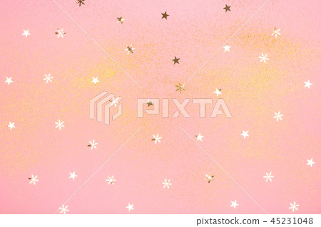 Light pink background with golden glitter. Light pink background with golden glitter. 45231048