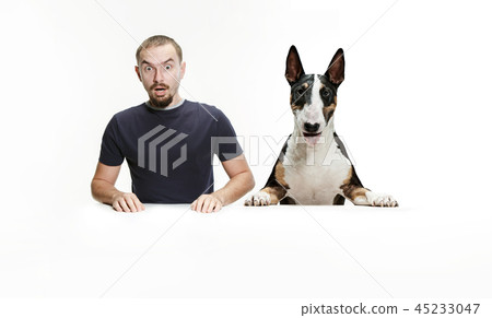 Emotional Portrait of a man and his shepherd dog, concept of friendship and care of man and animal Emotional Portrait of a man and his shepherd dog, concept of friendship and care of man and animal 45233047
