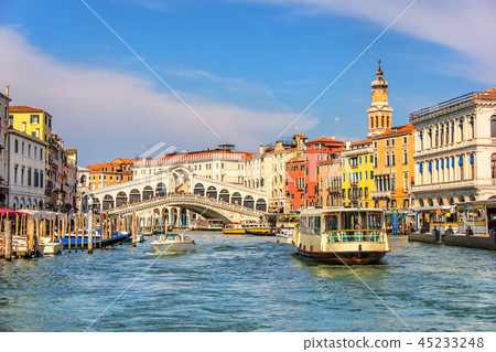 The Rialto Bridge and a vaporetto in a canal of Venice 45233248