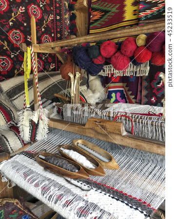 closeup of a weaving loom with colorful ropes 45233519