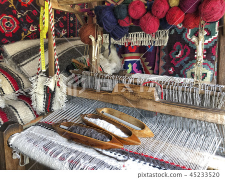 closeup of a weaving loom with colorful ropes 45233520