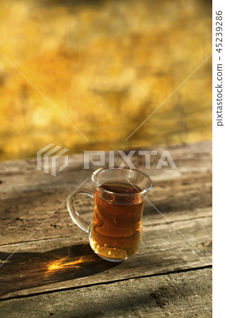 cup of tea on balcony with nature view. cup of tea on balcony with nature view. 45239286